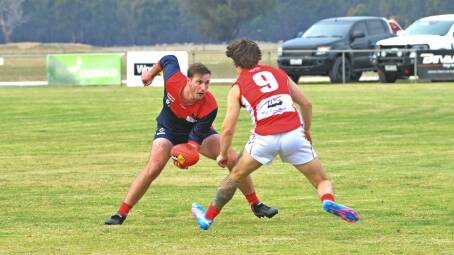 Locked on; Laharum's Patrick Laffy gets set to take on the Lakers defence at Cameron Oval. Picture by John Hall